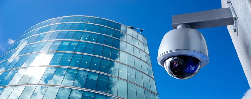 Dome surveillance camera on a commercial building