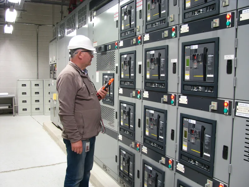 ICRS Service engineer performing voltage measurement tests in a substation